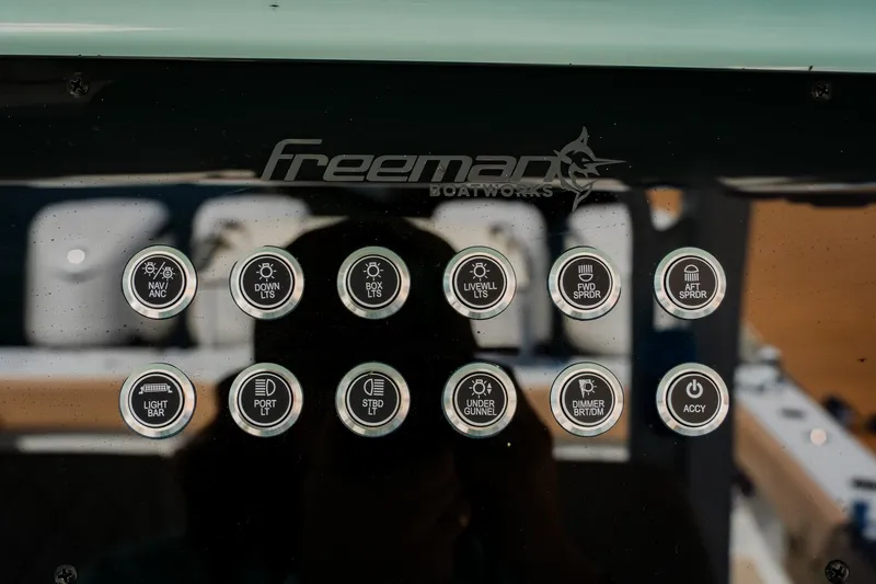  Yacht Photos Pics Control panel of Freeman 38 boat, featuring various labeled buttons, 2025 model.