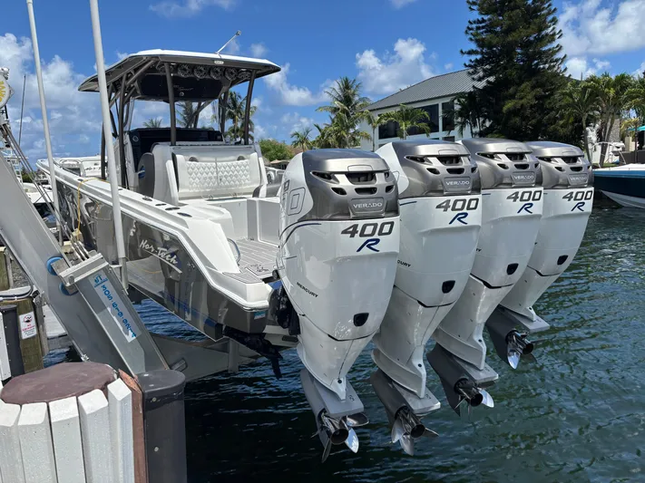  Yacht Photos Pics 2015 Nor-Tech 390 Sport boat with four Mercury 400R engines docked by the water.