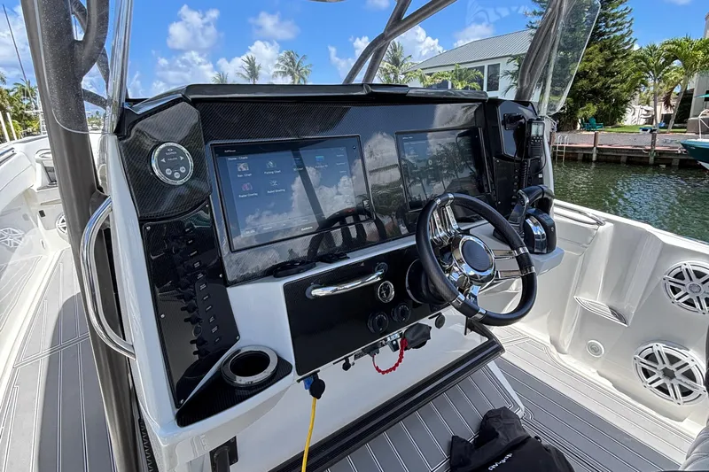  Yacht Photos Pics 2015 Nor-Tech 390 Sport boat dashboard with modern controls and dual screens.