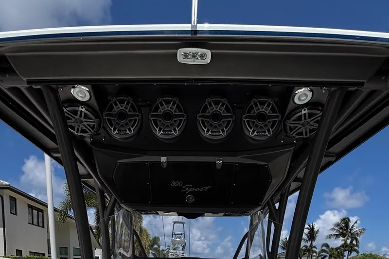  Yacht Photos Pics 2015 Nor-Tech 390 Sport boat speakers and canopy under a clear blue sky.