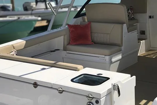  Yacht Photos Pics Manufacturer Provided Image: 2019 Everglades 340 Dual Console boat interior with beige seating and red cushion.
