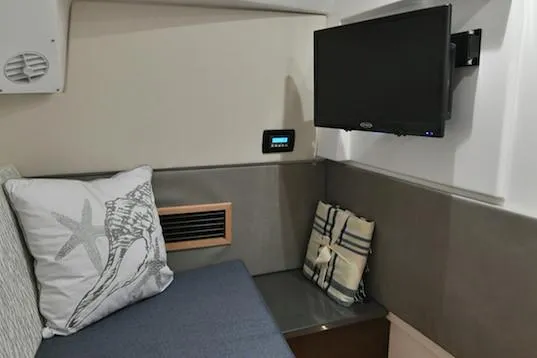  Yacht Photos Pics Manufacturer Provided Image: Interior cabin of 2019 Everglades 340 Dual Console with TV and seating area.