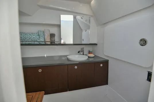  Yacht Photos Pics Manufacturer Provided Image: 2019 Everglades 340 Dual Console boat bathroom with modern sink and storage cabinets.