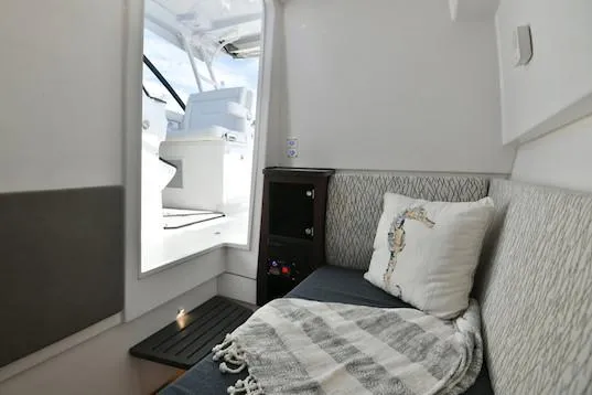  Yacht Photos Pics Manufacturer Provided Image: Interior cabin of 2019 Everglades 340 Dual Console boat with seating and decor.