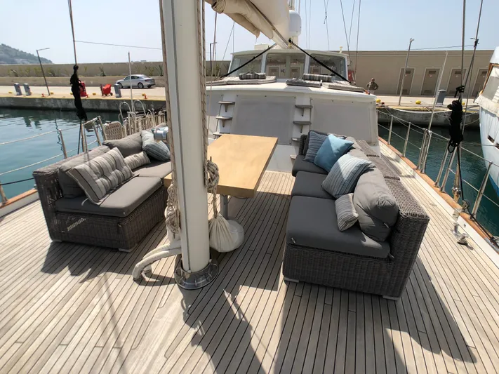 Atl 953 Yacht Photos Pics Spacious deck of 1991 Custom 23m Epoxy Hull yacht with comfortable seating and table.