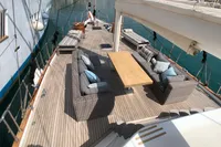 Spacious deck of 1991 Custom 23m Epoxy Hull yacht with elegant outdoor seating.