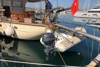 Custom 23m Epoxy Hull yacht with Yamaha motor and Turkish flag in marina, 1991 model.