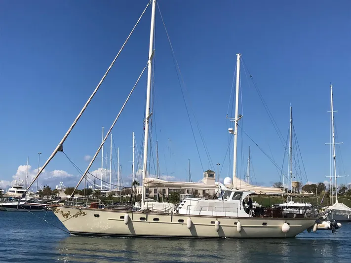 Atl 953 Yacht Photos Pics Sailing yacht with custom 23m epoxy hull, 1991 model, docked in a marina under clear blue sky.