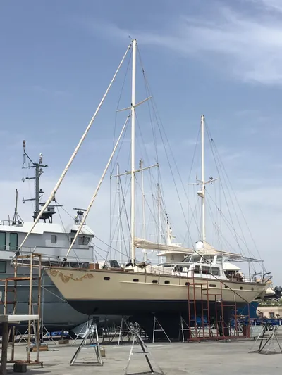 Atl 953 Yacht Photos Pics Sailboat with dual masts, Custom 23m Epoxy Hull, 1991, docked for maintenance.