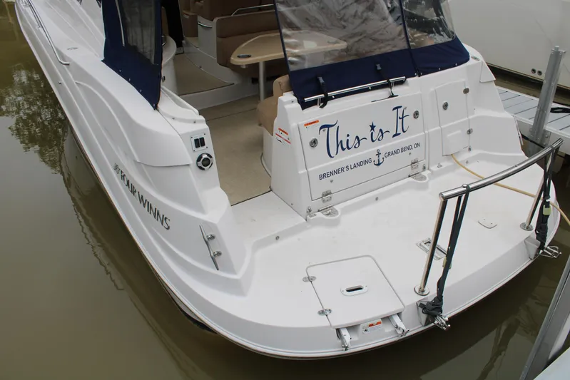  Yacht Photos Pics 2011 Four Winns V335 boat docked, featuring "This is It" on the stern.