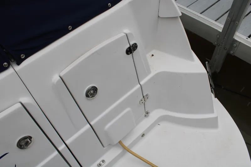 Yacht Photos Pics 2011 Four Winns V335 boat deck with storage compartments and dock view.