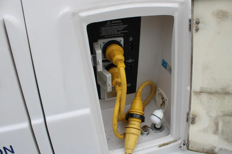  Yacht Photos Pics Electrical connection panel on a 2011 Four Winns V335 boat with yellow power cables.