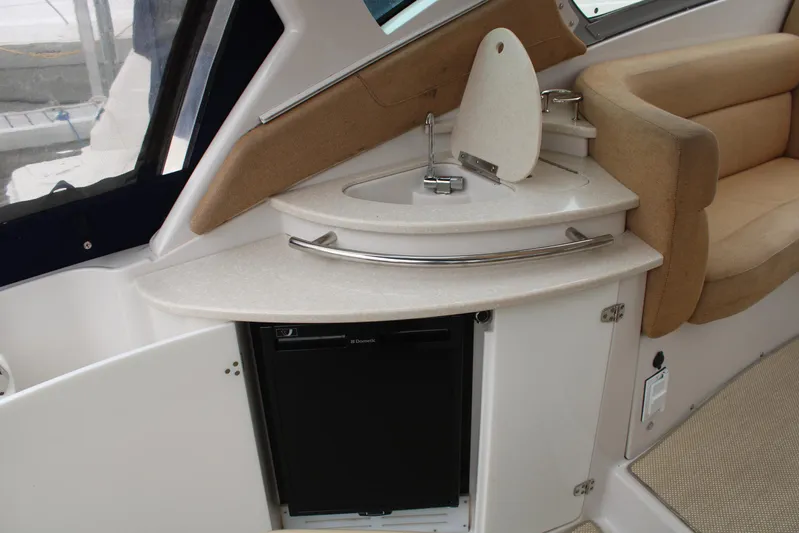  Yacht Photos Pics 2011 Four Winns V335 boat interior with kitchenette and seating area.