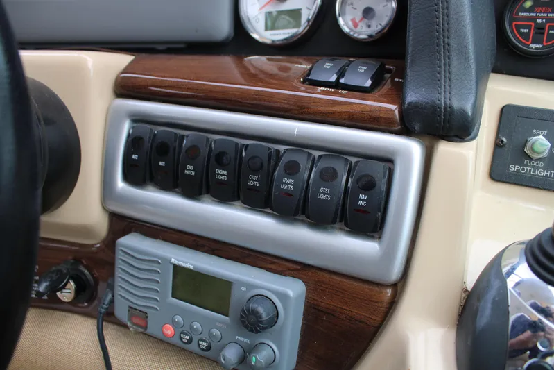  Yacht Photos Pics Control panel of a 2011 Four Winns V335 boat with switches and gauges.