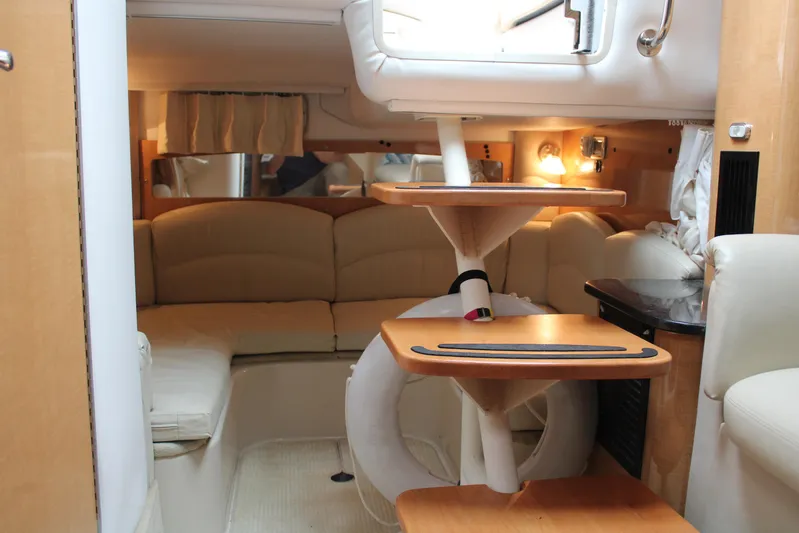  Yacht Photos Pics Interior of 2011 Four Winns V335 boat with beige seating and wooden accents.