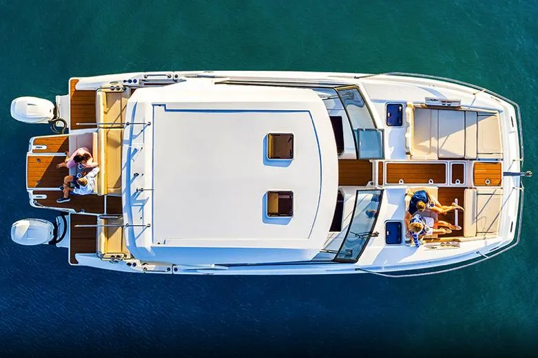  Yacht Photos Pics Manufacturer Provided Image: Aerial view of 2023 Aquila 36 Sport yacht on clear blue water.