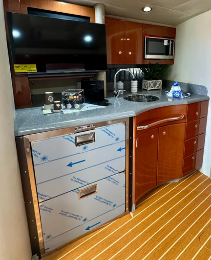  Yacht Photos Pics 2006 Formula 40pc yacht kitchen with modern appliances and wood cabinetry.