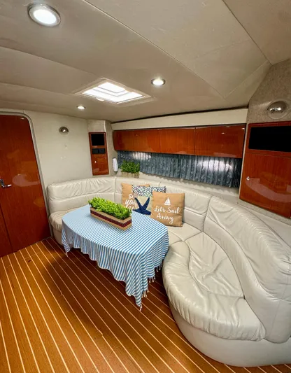  Yacht Photos Pics Luxurious 2006 Formula 40pc yacht interior with elegant seating and wooden flooring.