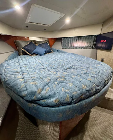  Yacht Photos Pics Cozy bedroom in 2006 Formula 40pc yacht with blue bedding and Netflix on TV.