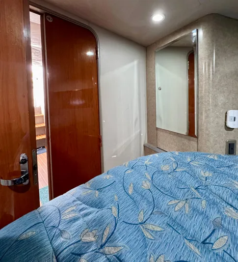  Yacht Photos Pics Interior cabin of a 2006 Formula 40pc boat with blue floral bedding.