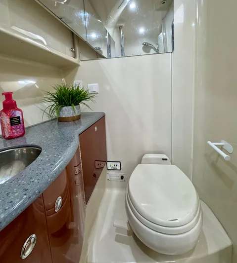  Yacht Photos Pics Luxurious bathroom in a 2006 Formula 40pc yacht with modern amenities and sleek design.