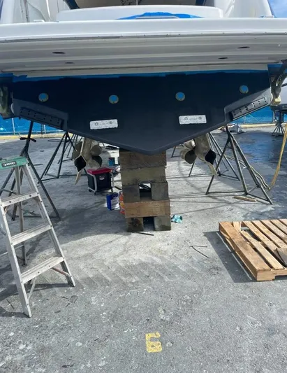  Yacht Photos Pics 2006 Formula 40pc boat under maintenance, supported by blocks and ladders.