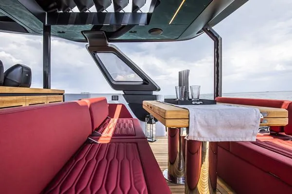  Yacht Photos Pics 2025 Cranchi A46 Luxury Tender interior with red seating and elegant dining area.