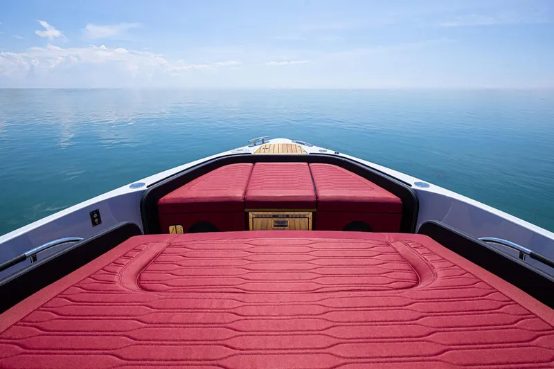  Yacht Photos Pics 2025 Cranchi A46 Luxury Tender with red upholstery on calm sea.