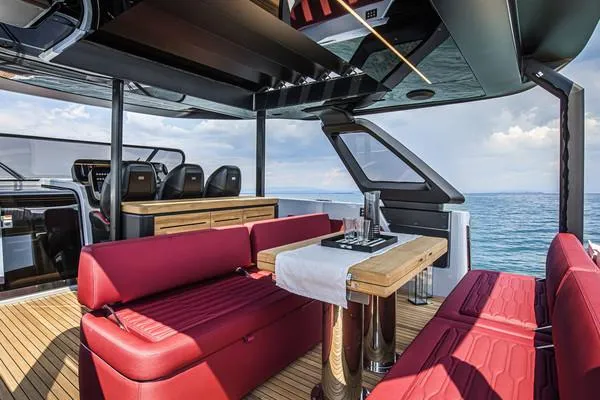  Yacht Photos Pics Luxurious 2025 Cranchi A46 Tender with red seating and elegant dining area on deck.