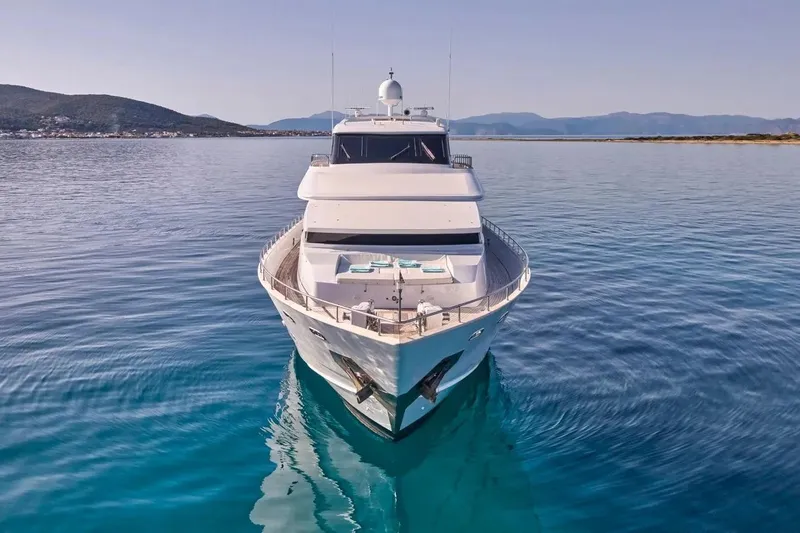 Let It Be Yacht Photos Pics Luxurious 1998 Tecnomarine Custom yacht on serene blue waters, front view.