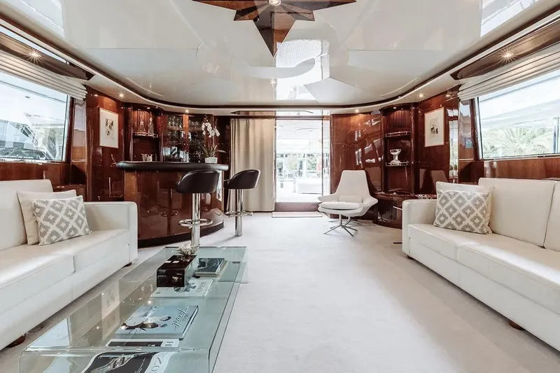 Let It Be Yacht Photos Pics Luxurious Tecnomarine Custom 1998 yacht interior with elegant seating, glass table, and bar area.