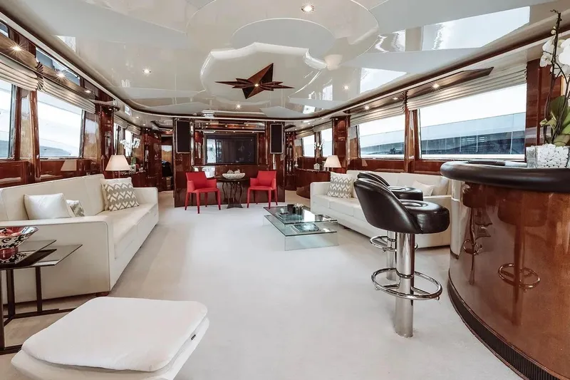 Let It Be Yacht Photos Pics Luxurious interior of a 1998 Tecnomarine Custom yacht with elegant seating and modern decor.