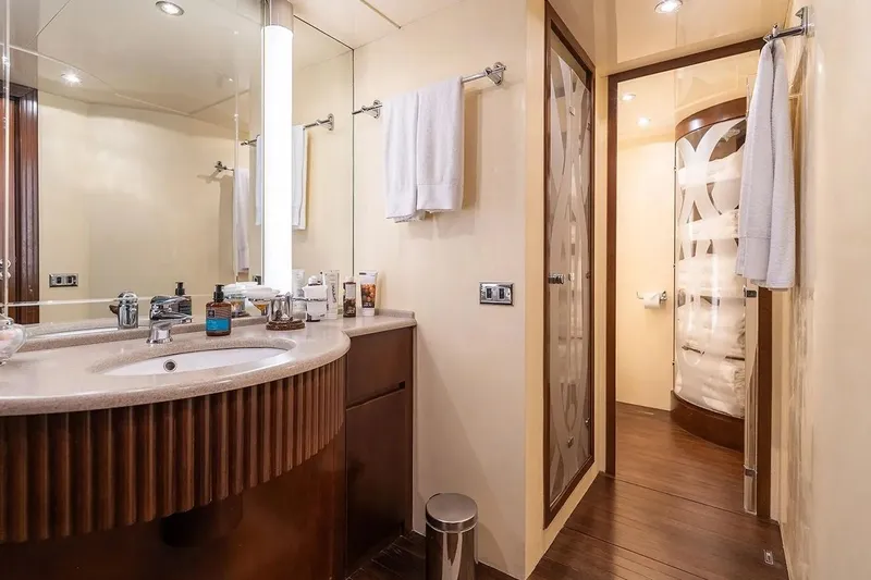 Let It Be Yacht Photos Pics Luxurious Tecnomarine Custom 1998 yacht bathroom with modern fixtures and elegant design.