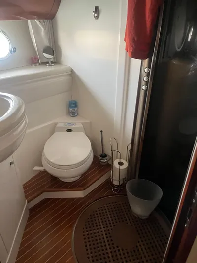 C Glass Yacht Photos Pics Bathroom interior of 2000 Princess 65 M/Y yacht with toilet and shower.