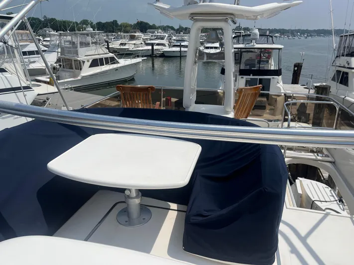 C Glass Yacht Photos Pics Flybridge view of a 2000 Princess 65 M/Y yacht docked at a marina.