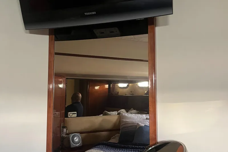 C Glass Yacht Photos Pics Interior of a 2000 Princess 65 M/Y yacht with cozy bedroom and TV.