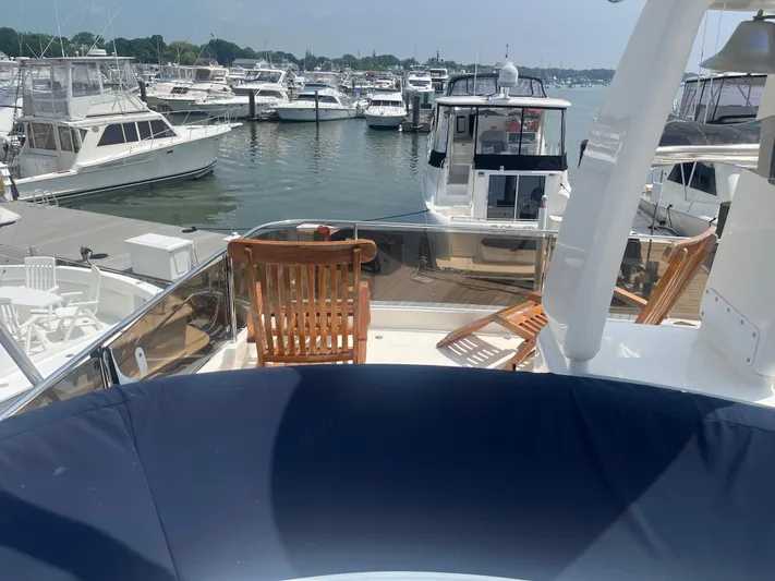 C Glass Yacht Photos Pics Luxury yacht docked at marina, featuring wooden deck chairs, Princess 65 M/Y, 2000 model.