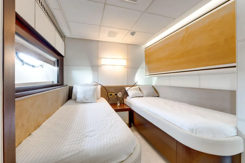 Ginger Yacht Photos Pics Luxurious twin cabin interior on 2006 Pershing 115 yacht, featuring modern design and cozy beds.