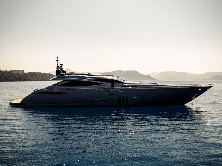 Ginger Yacht Photos Pics Luxury 2006 Pershing 115 yacht on calm sea with scenic mountain backdrop.