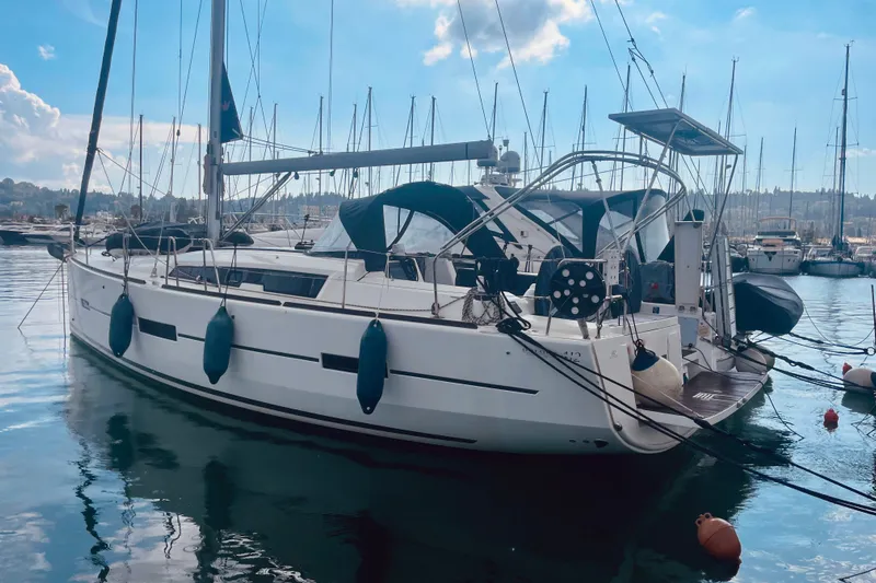  Yacht Photos Pics Sailboat Dufour 41.2 GL 2015 docked in marina, clear sky, calm water.