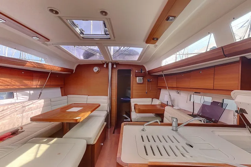  Yacht Photos Pics Interior of 2015 Dufour 41.2 GL yacht with modern kitchen and seating area.