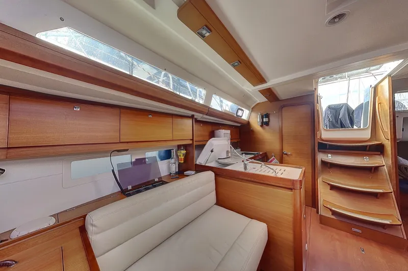  Yacht Photos Pics Interior of 2015 Dufour 41.2 GL yacht with wooden cabinetry and seating.