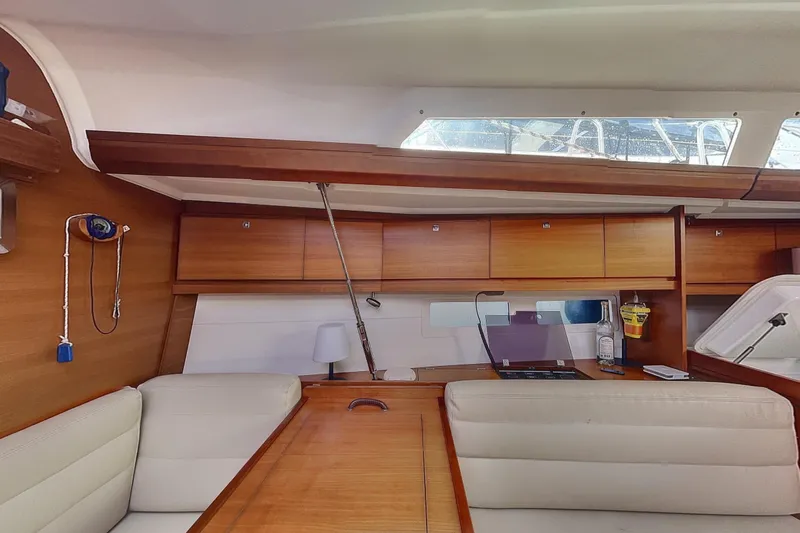  Yacht Photos Pics Interior of 2015 Dufour 41.2 GL yacht with wooden cabinetry and seating.