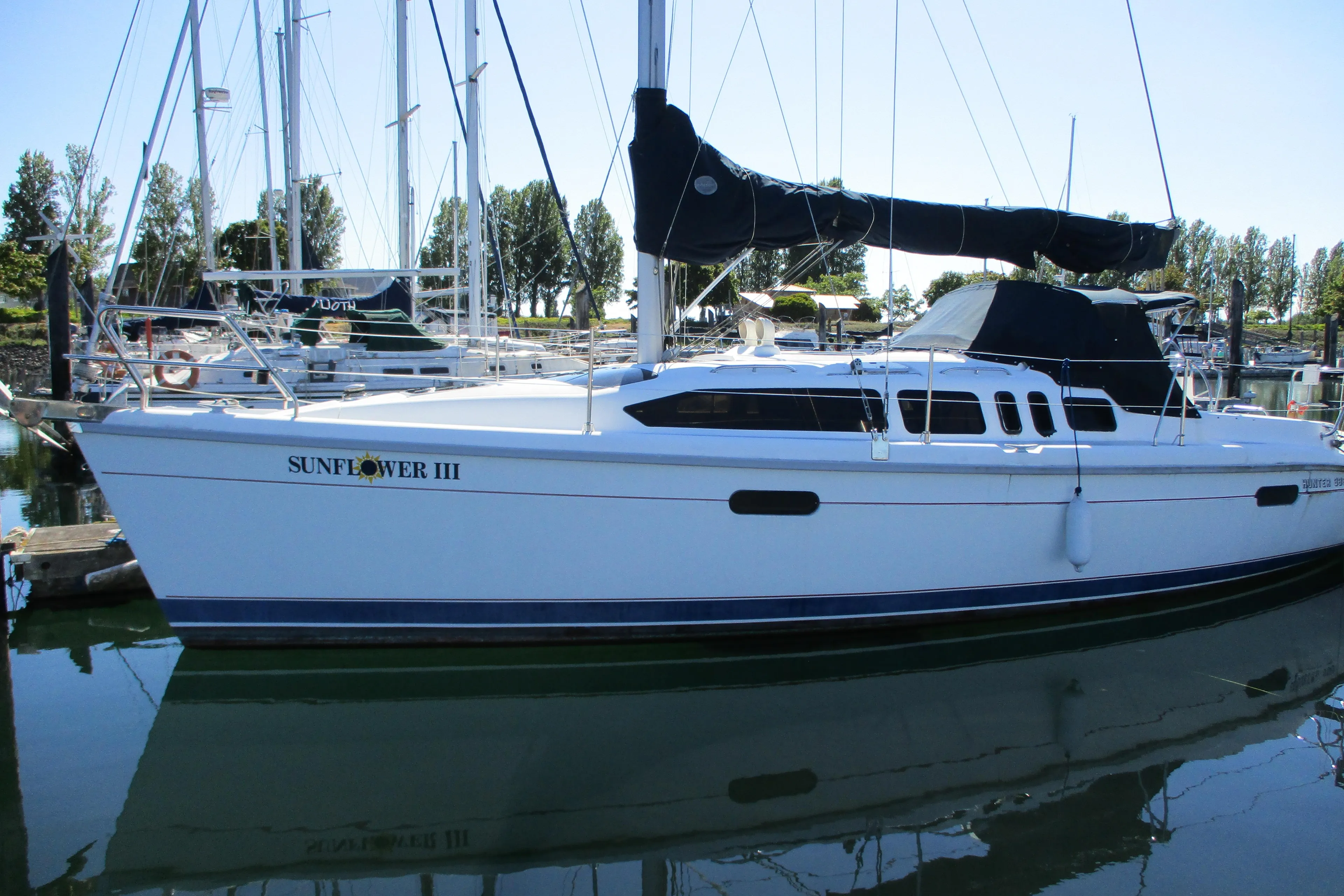 1995 Hunter 336 sailboat docked, named Sunflower III.