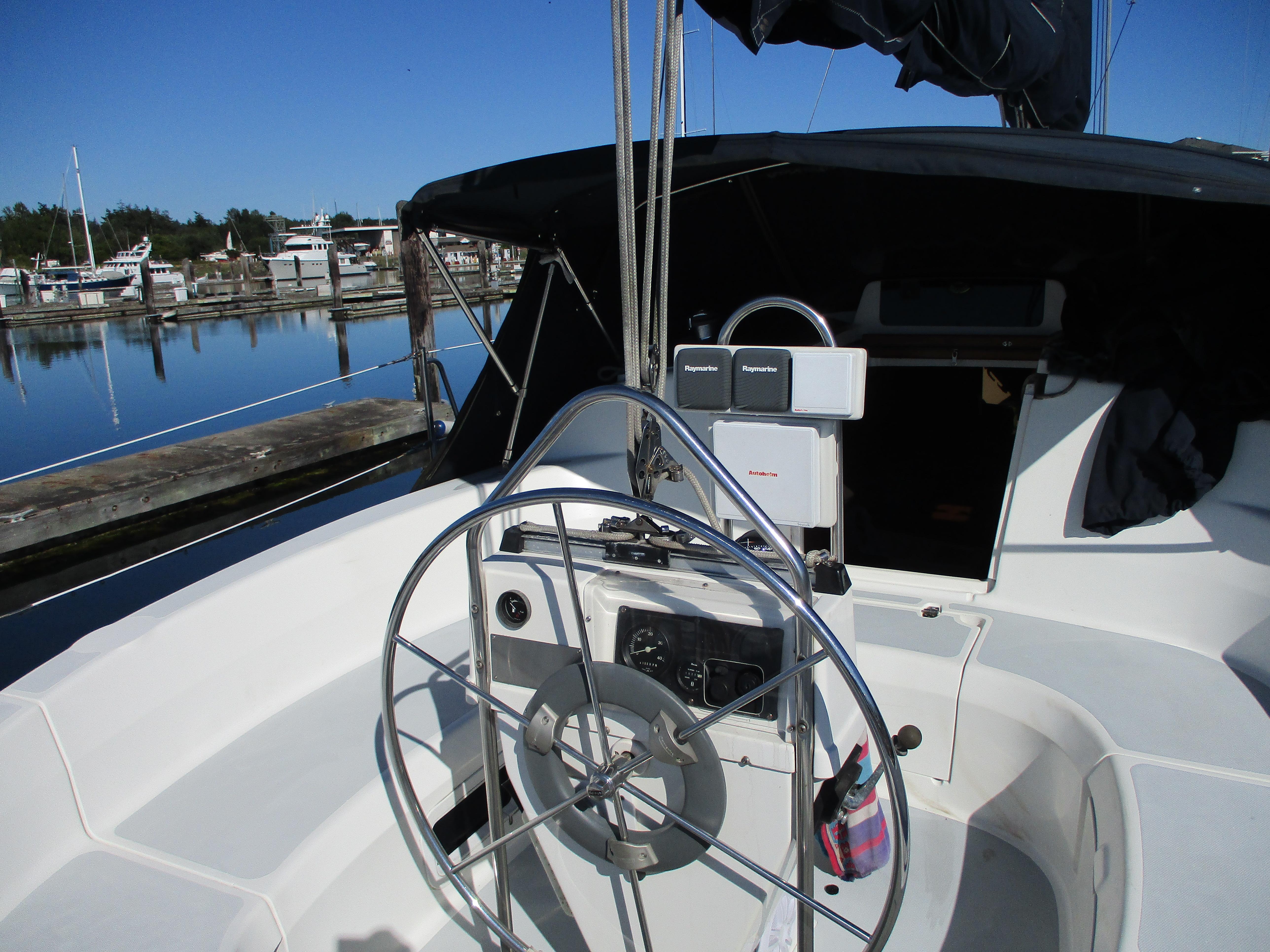 Cockpit of a 1995 Hunter 336 sailboat in harbor.