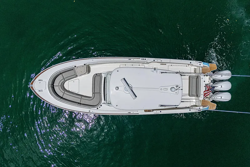Tropical Breeze Yacht Photos Pics Top view of 2020 Hinckley Sport Boat 40 C on green water.