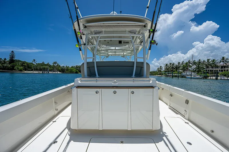 Tropical Breeze Yacht Photos Pics 2020 Hinckley Sport Boat 40 C on water, showcasing sleek design and spacious deck.