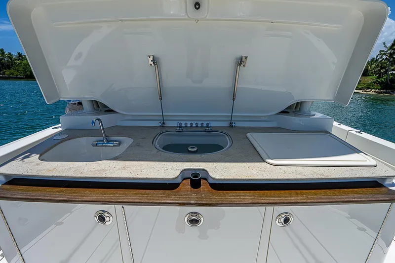 Tropical Breeze Yacht Photos Pics Hinckley Sport Boat 40 C 2020 outdoor kitchen with sink and cutting board.