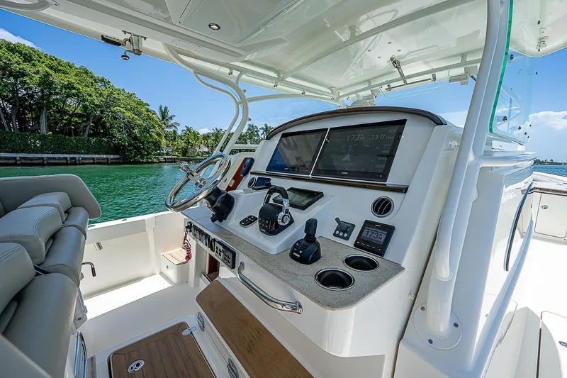 Tropical Breeze Yacht Photos Pics 2020 Hinckley Sport Boat 40 C helm with modern controls and scenic water view.