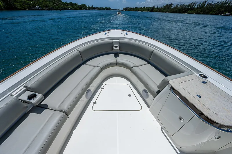 Tropical Breeze Yacht Photos Pics 2020 Hinckley Sport Boat 40 C, spacious seating, cruising on a serene waterway.